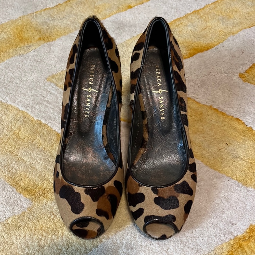 Leopard pony peekaboo toe pumps.